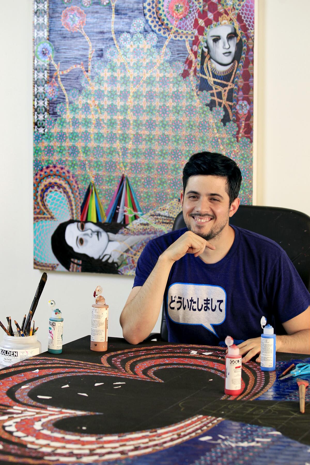 Artist Asad Faulwell, 31, poses for a photo at his home studio in Newport Beach. The Orange County Museum of Art will host Art Auction 2014, with more than 60 museum-quality works of art that will be auctioned off on March 14. Proceeds benefit the museum's exhibition and education programs.