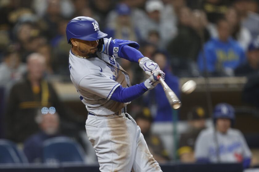 Los Angeles Dodgers' Mookie Betts hits a home run against the San Diego Padres.