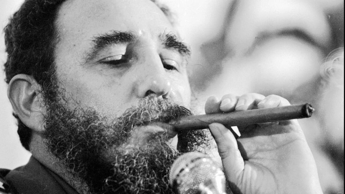 Former Cuban president Fidel Castro, who on Friday, smoking a cigar in 1978.