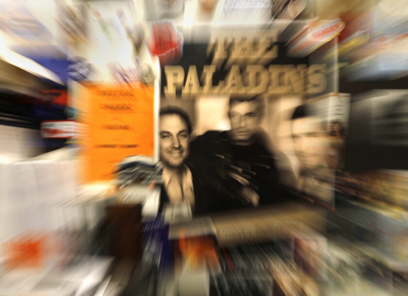 Thomas Yearsley, left in poster, and owner of the studio for seven years is the bassist of the Paladins.
