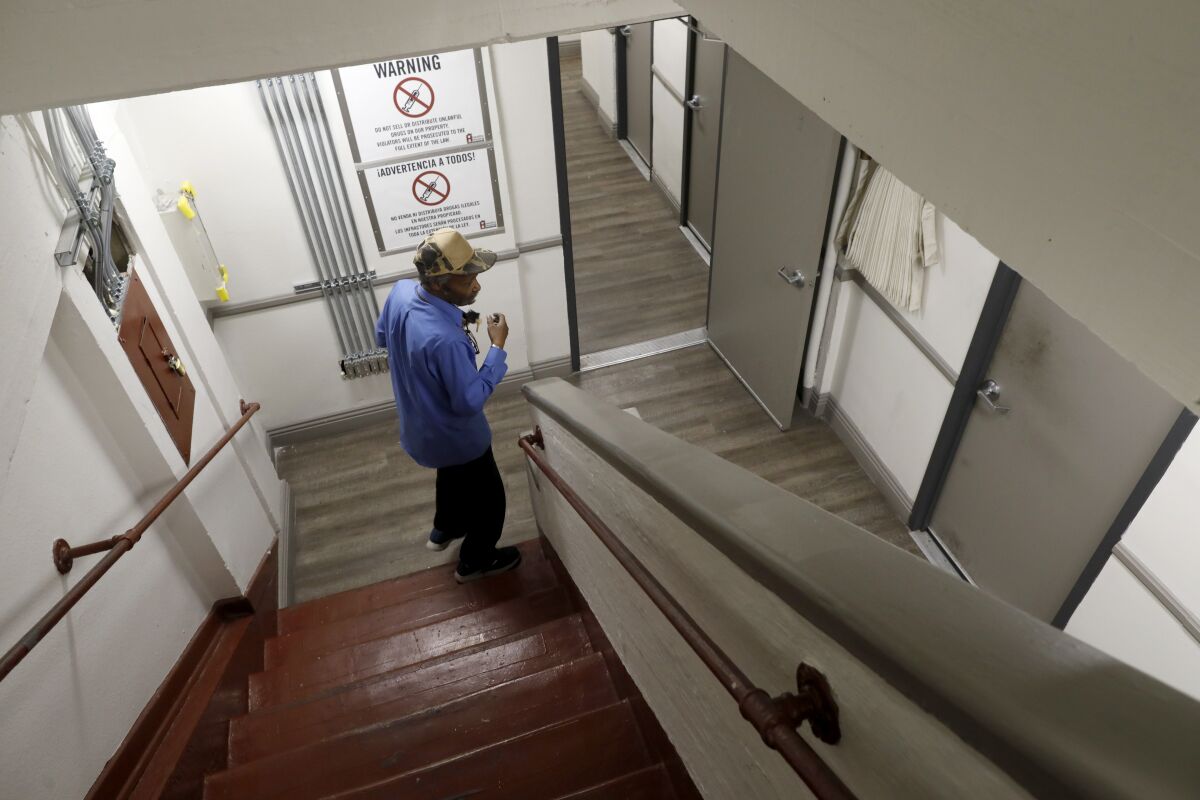 Edwin Linwood and other tenants of the Madison Hotel take the stairs because of a broken elevator.