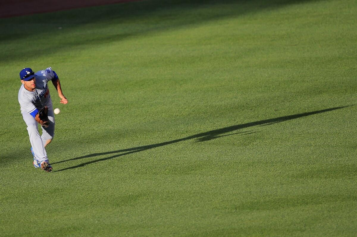 Dodgers right fielder Andre Ethier makes a catch against the Colorado Rockies on May 31. Dodgers manager Don Mattingly says Either "has been great" playing in center field for the Dodgers.