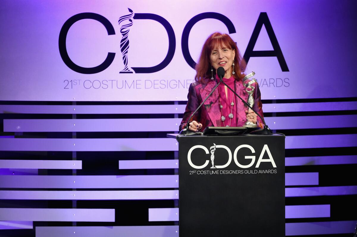 Mary E. Vogt accepts the award for contemporary film for "Crazy Rich Asians" at the 21st Costume Designers Guild Awards.