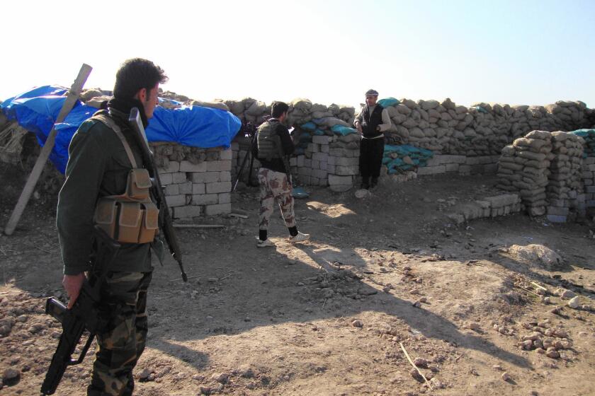 Kurdish peshmerga fighters on Mt. Bashiqa have been keeping an eye of Mosul below. There are signs Isalmic State's grip on the city is slipping, the Kurds said. Recent militant convoys from Mosul have been smaller and less frequent.