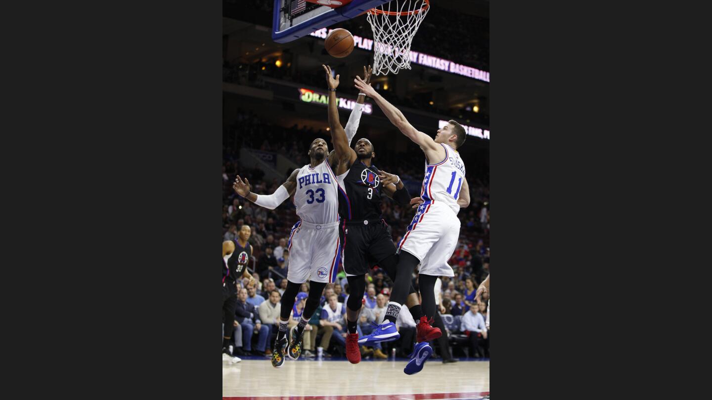 Chris Paul, Robert Covington, Nik Stauskas