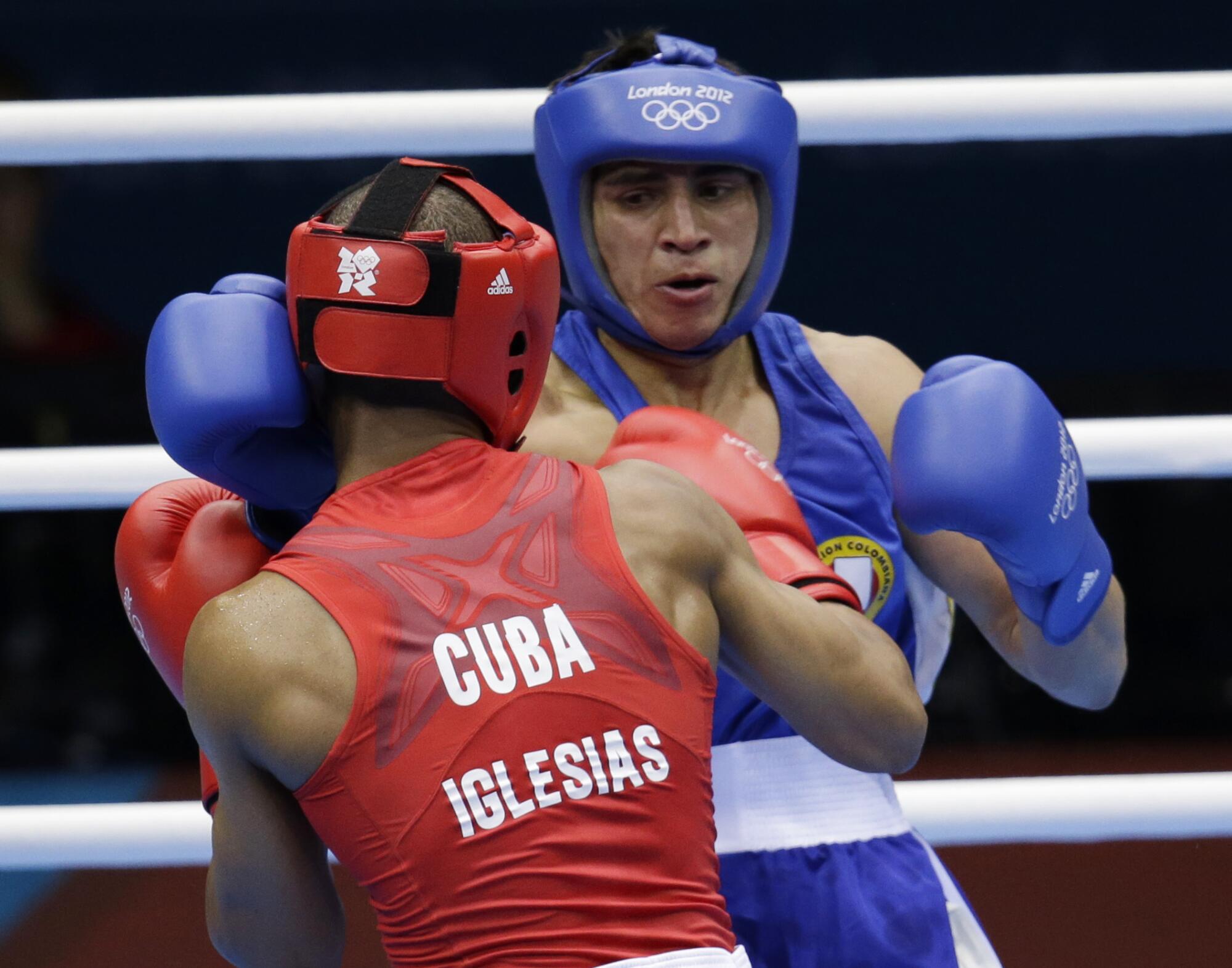 Cuba's Roniel Iglesias Sotolongo, left, fights Colombia's Cesar Villarraga Aldana.