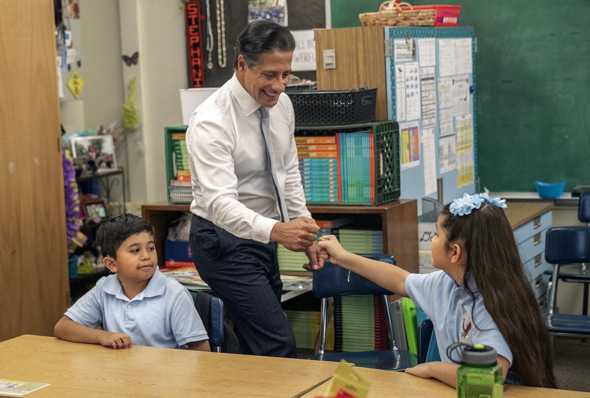 L.A. Unified School District Supt. Alberto Carvalho greets third graders at Martlon School in Los Angeles on Aug. 15.