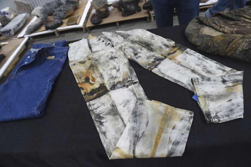 FILE - A pair of work pants, possibly made by or for Levi Strauss, from the S.S. Central America are seen in a warehouse in Sparks, Nev., on May 4, 2022. Pulled from a sunken trunk at an 1857 shipwreck off the coast of North Carolina, work pants that auction officials describe as the oldest known pair of jeans in the world have sold for $114,000. (Jason Bean/The Reno Gazette-Journal via AP, File)