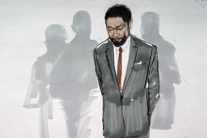 FILE - In this courtroom sketch, actor Jussie Smollett stands with his legal team in a Leighton Criminal Courthouse courtroom on Dec. 9, 2021, in Chicago, after a jury found him guilty on five of six charges he staged a racist, anti-gay attack on himself and lied to police about it. The lone Black juror on the panel that convicted Jussie Smollett of lying to police about what authorities say was a staged hate crime says he cannot get past how the actor put a noose around his neck when police were coming to interview him. (AP Photo/Cheryl Cook, File)