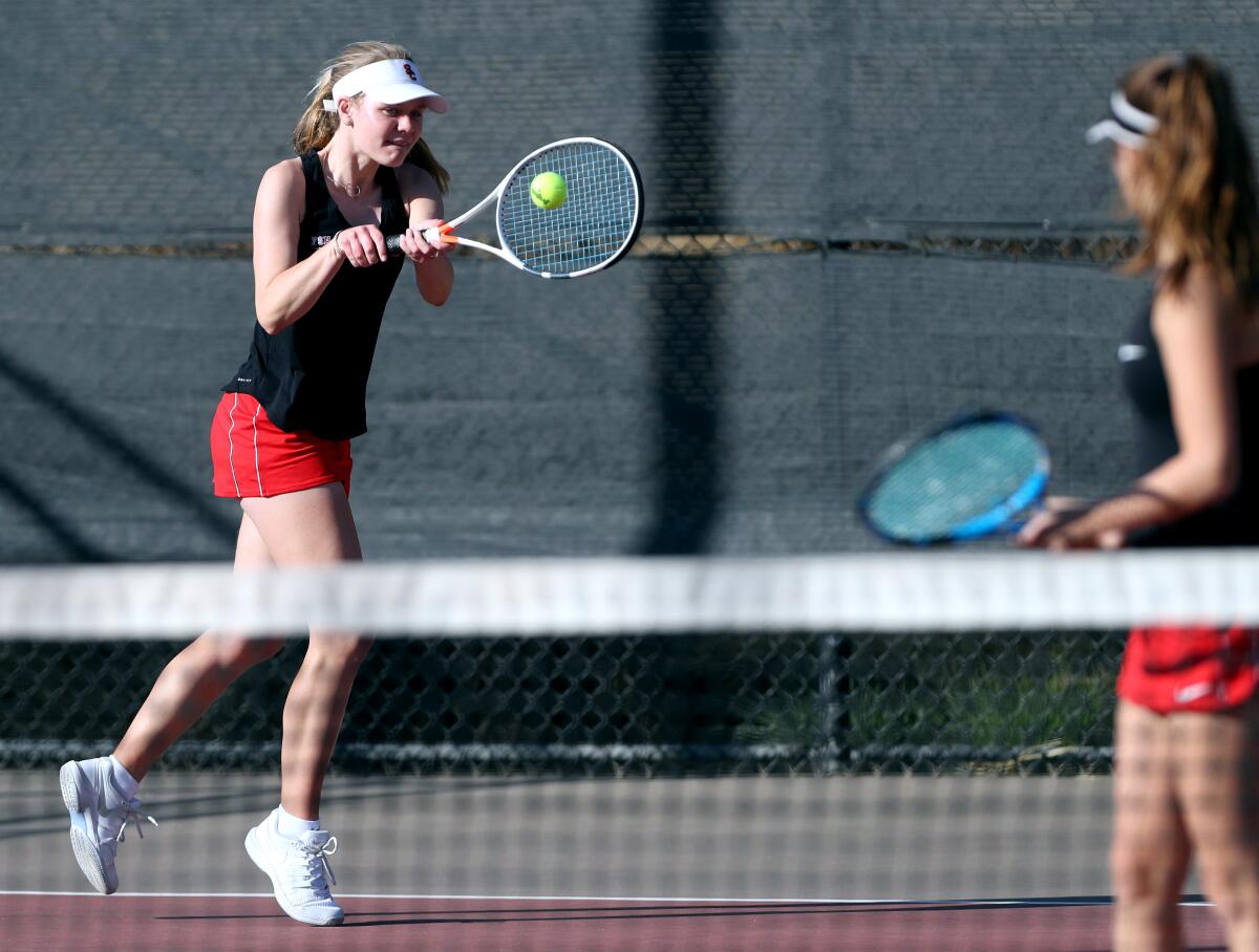 Flintridge Sacred Heart Academy tennis doubles player Claire McDonald returns the ball in home game vs. Century or Torrance in CIF Southern Section Division IV first-round playoff match at Scholl Canyon Golf & Tennis Club in Glendale on Wednesday, Nov. 6, 2019.
