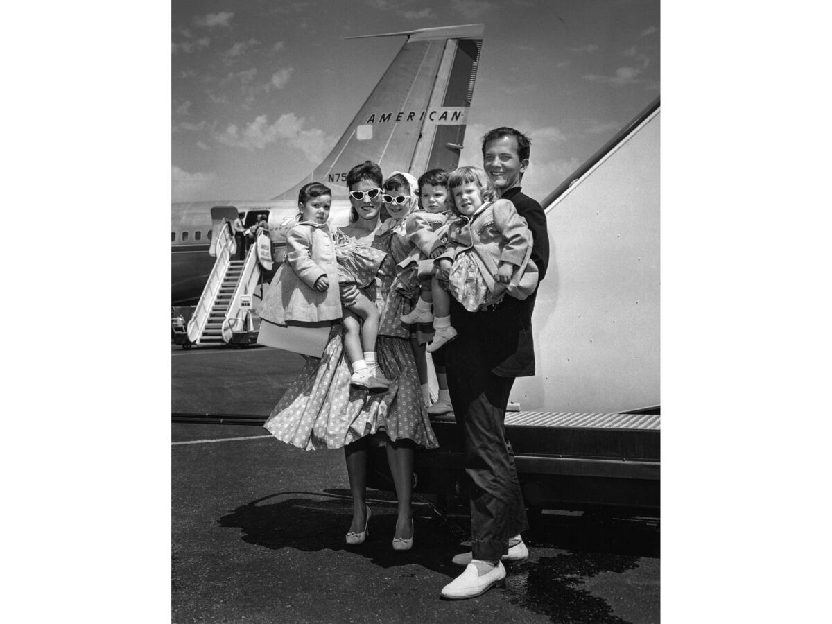  Pat Boone poses with his family at Los Angeles International Airport.  