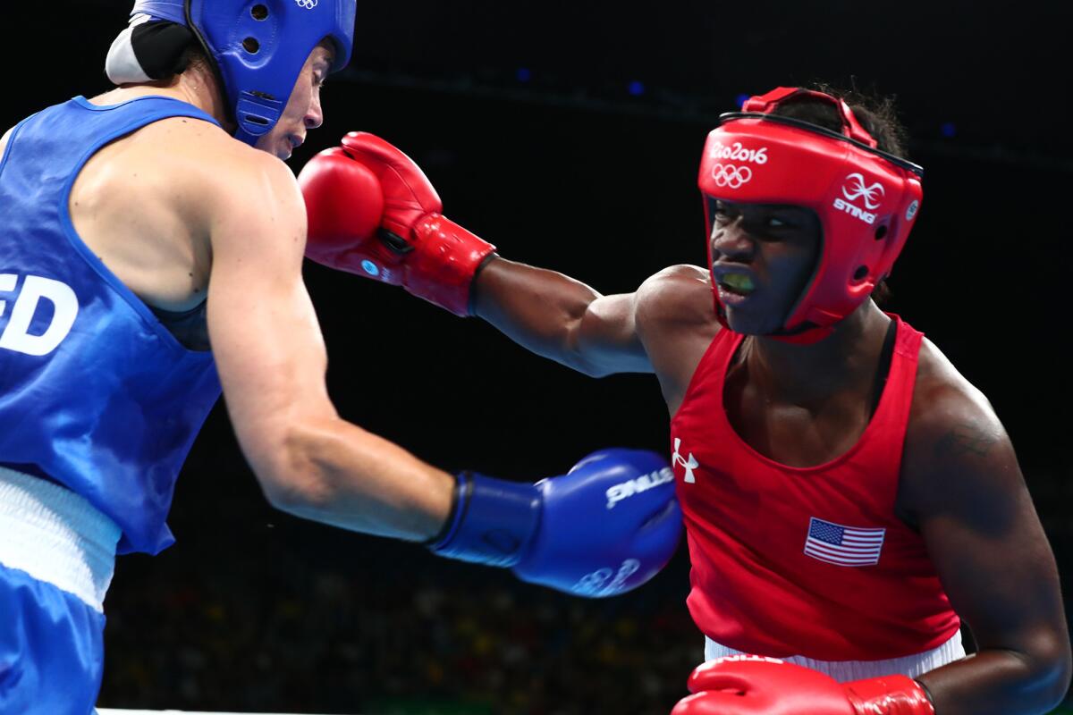 U.S. boxer Claressa Shields, right, battles Nouchka Fontijn of the Netherlands in the somen's middleweight final at Riocentro Pavilion 6. Shields won by a unanimous decison.