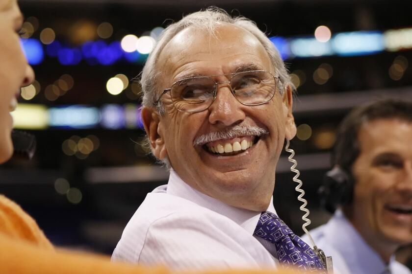 Clippers play-by-play announcer Ralph Lawler calls a game at Staples Center in 2009.