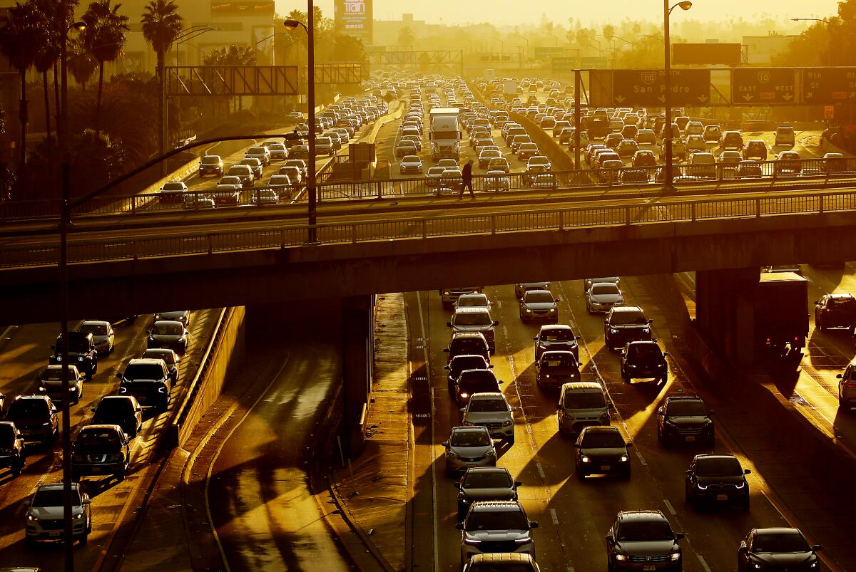 Motor traffic crawls in both directions of the Harbor Freeway in downtown Los Angeles in November 2022.