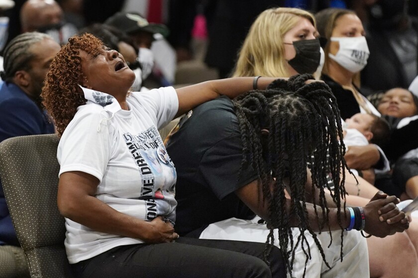 Family members react during the funeral for Andrew Brown Jr., Monday, May 3, 2021, at Fountain of Life Church in Elizabeth City, N.C. Brown was fatally shot by Pasquotank County Sheriff deputies trying to serve a search warrant. (AP Photo/Gerry Broome)