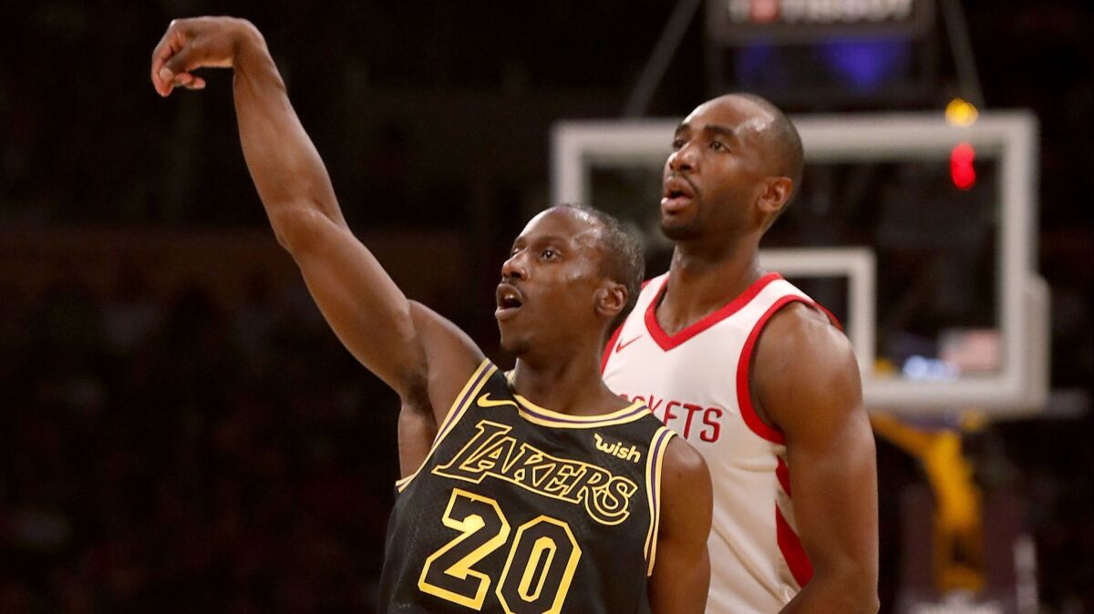 Lakers guard Andre Ingram follows through on a three-point shot against the Houston Rockets on April 10.