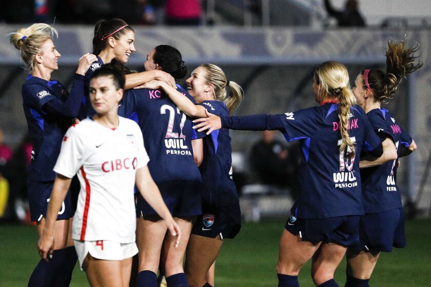 San Diego, CA - March 25: San Diego Wave's Alex Morgan (13) and teammates celebrate her goal against the Chicago Red Stars during the season opener at Snapdragon Stadium on Saturday, March 25, 2023 in San Diego, CA. (Meg McLaughlin / The San Diego Union-Tribune)