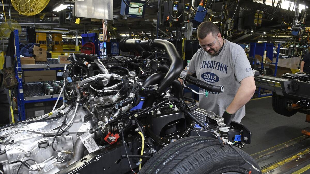 A worker assembles trucks at Ford's Kentucky Truck Plant in Louisville, Ky., in October.