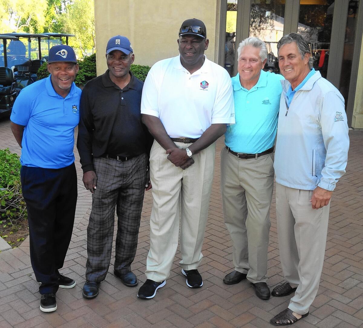 From left, former Rams LeRoy Irvin, Lawrence McCutcheon, Jackie Slater, Nolan Cromwell and Vince Ferragamo participate in the Rich Saul Memorial Golf Classic in 2016.
