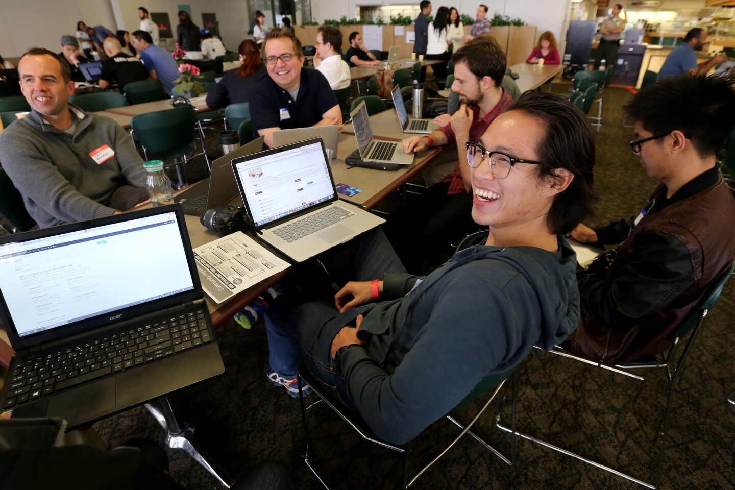A group at L.A.'s "hackathon" share a light moment while brainstorming on Day 1 of the two-day event, which aims to use the skills of the technology sector to develop tools to improve residents' lives.