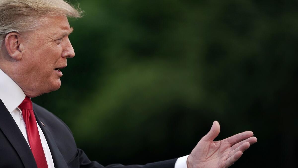 President Trump talks to journalists in Washington on May 20.