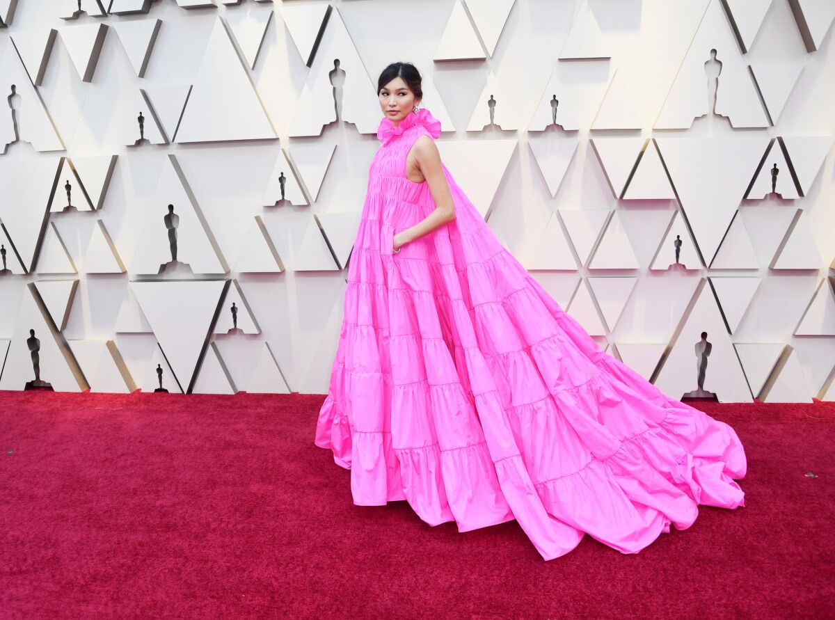 The pockets on Gemma Chan's Valentino couture gown would come in handy as Oscar night progressed.