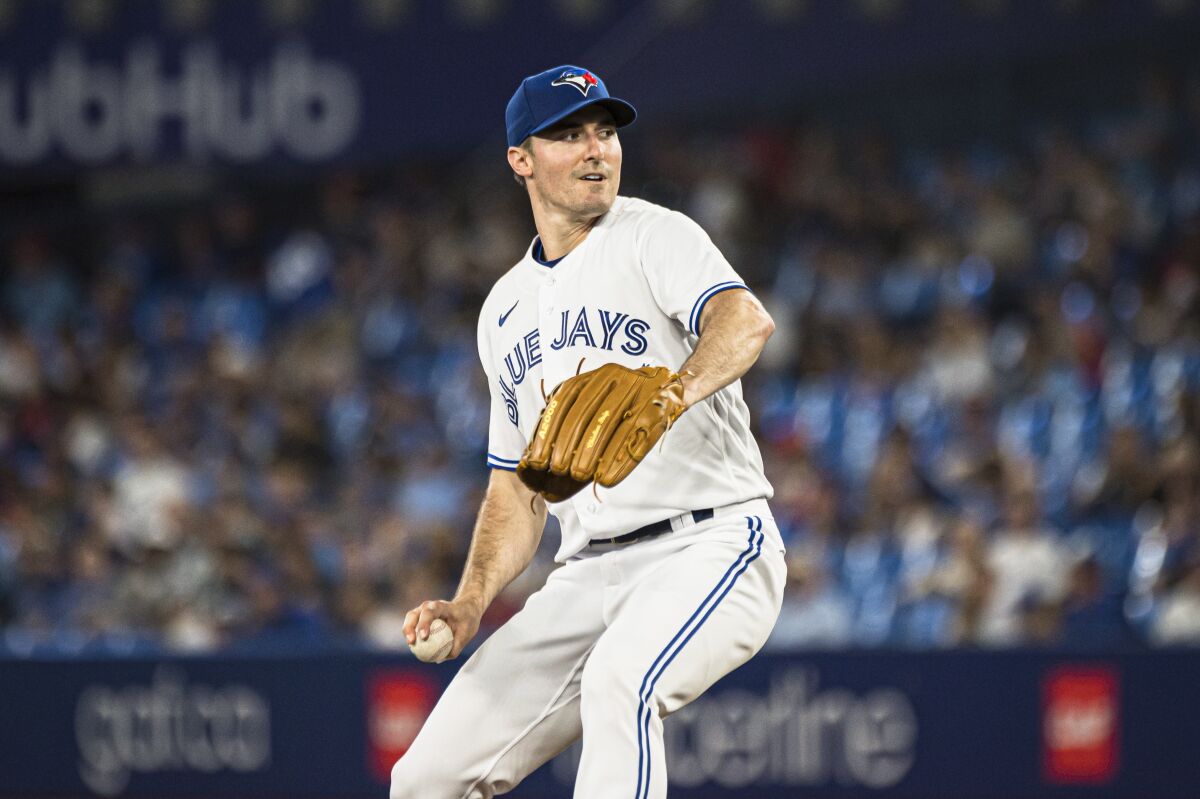 Toronto Blue Jays starting pitcher Ross Stripling (48) throws during first inning of a baseball game against the Baltimore Orioles, in Toronto on Wednesday, Aug. 17, 2022. (Christopher Katsarov/The Canadian Press via AP)