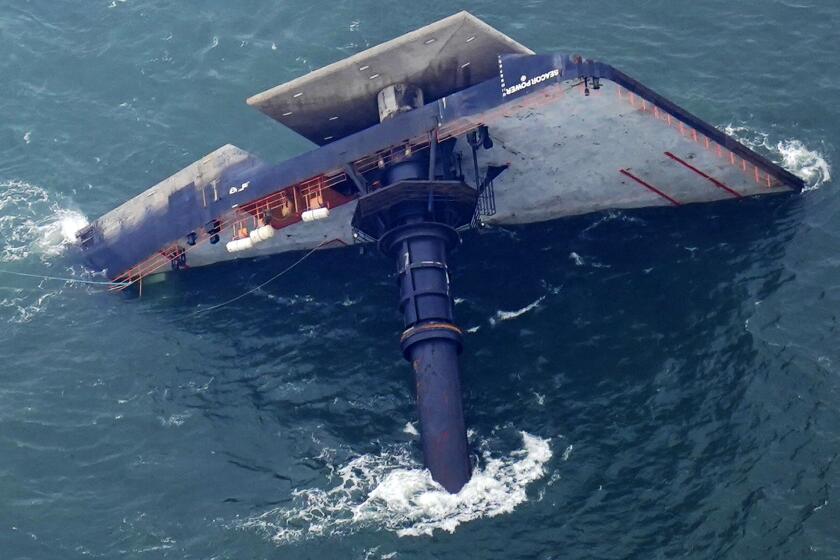 The capsized lift boat Seacor Power is seen seven miles off the coast of Louisiana in the Gulf of Mexico Sunday, April 18, 2021. The vessel capsized during a storm on Tuesday. (AP Photo/Gerald Herbert)
