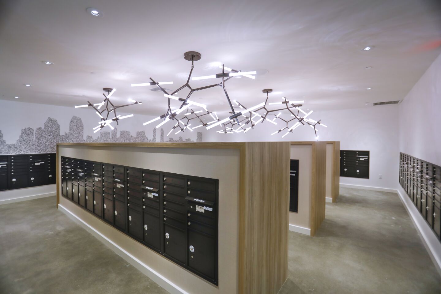 A light sculpture is above the mail boxes in the mail lounge at One Paseo, the upscale apartment homes project in Carmel Valley, part of the 23-acre mixed-use project. Photographed October 8, 2019, in San Diego, California.