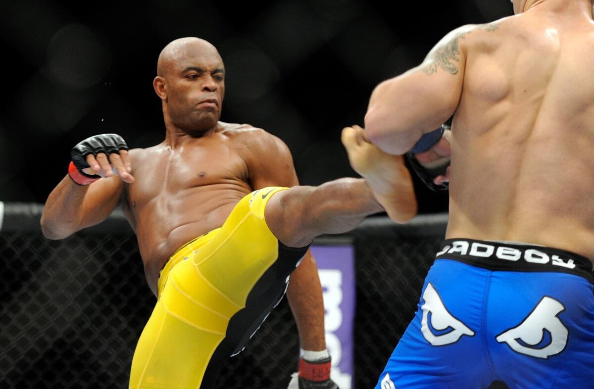 Anderson Silva, left, kicks Chris Weidman during their UFC 162 middleweight title fight. Silva lost the fight.