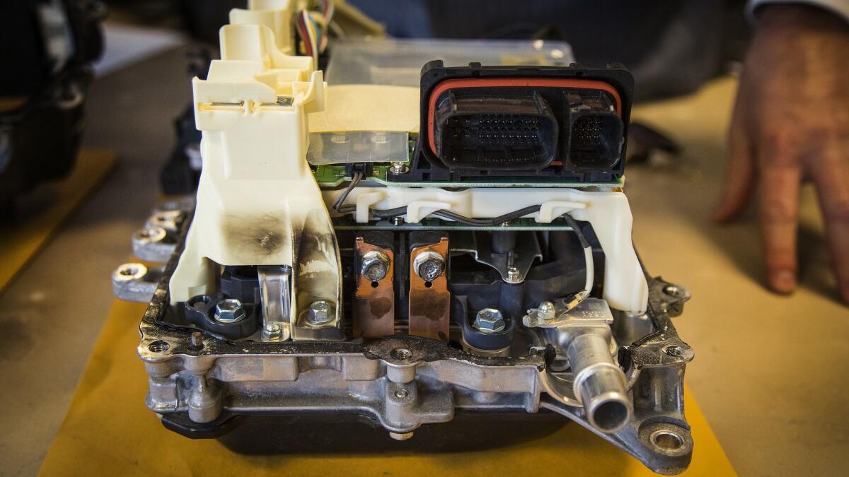 This defective power inverter came out of a 2012 Prius. The car lost power in January while being driven in San Juan Capistrano, Calif. The burn marks show how the inverter overheated and melted components.