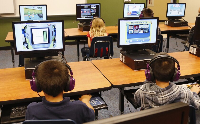 Students at a summer reading academy work in the computer lab at Buchanan Elementary School in Oklahoma City in July. President Obama called Saturday for capping standardized testing at 2% of classroom time, while conceding the government shares responsibility for having turned tests into the be-all and end-all of American school achievement.