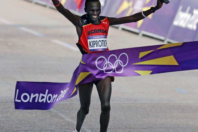 Gold-medalist Stephen Kiprotich of Uganda crosses finish line in a time of 2:08:01.