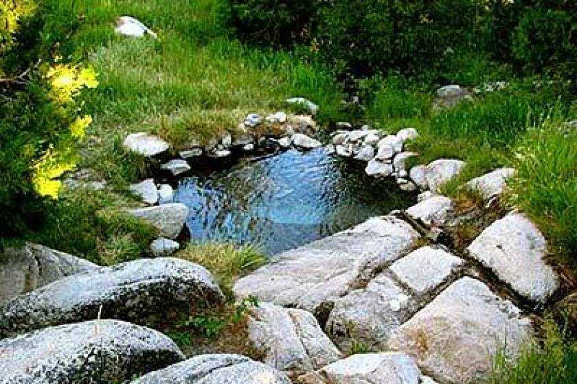 Surrounded by meadows, the Iva Bell natural hot springs soothe trail-weary muscles after a 13-mile climb.