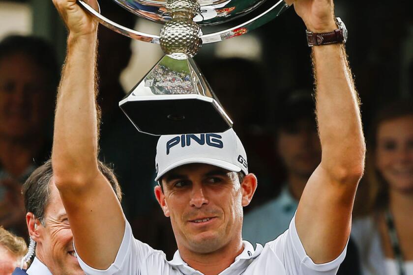 Billy Horschel lifts the FedEx Cup after winning the PGA tour championship Sept. 14 in Atlanta.