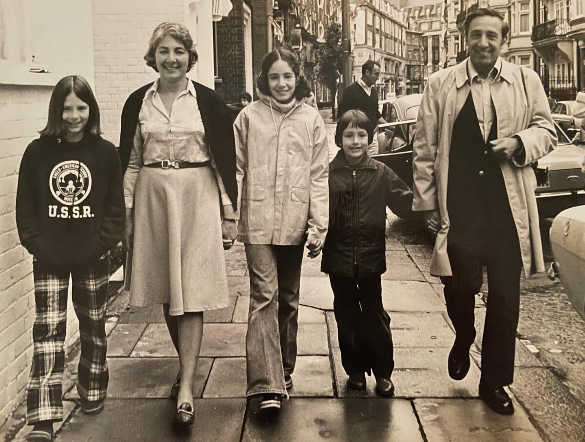 Robert C. Toth walks down a London sidewalk with his wife and three children in 1977