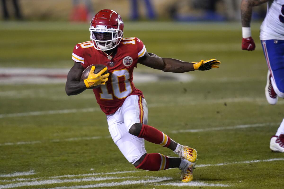 Kansas City Chiefs wide receiver Tyreek Hill runs up field after catching a pass against the Buffalo Bills.