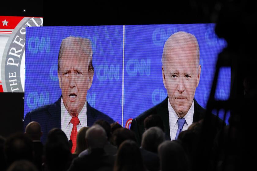 LOS ANGELES, CA - JUNE 27, 2024: People watch the presidential debate between Donald Trump and Joe Biden at XR Studio on June 27, 2024 in Los Angeles, California.(Gina Ferazzi / Los Angeles Times)