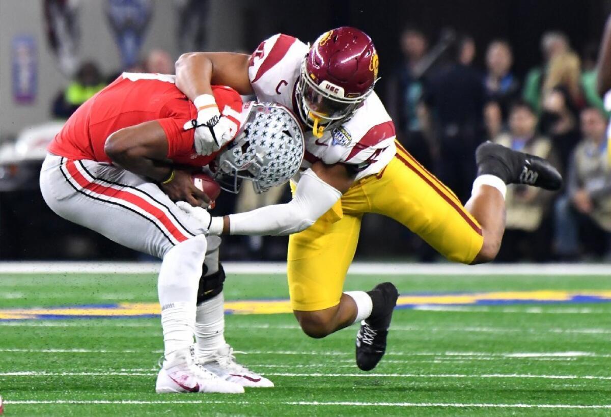 USC linebacker Uchenna Nwosu sacks Ohio State quarterback J.T. Barrett in the Cotton Bowl at AT&T Stadium on Dec. 29.