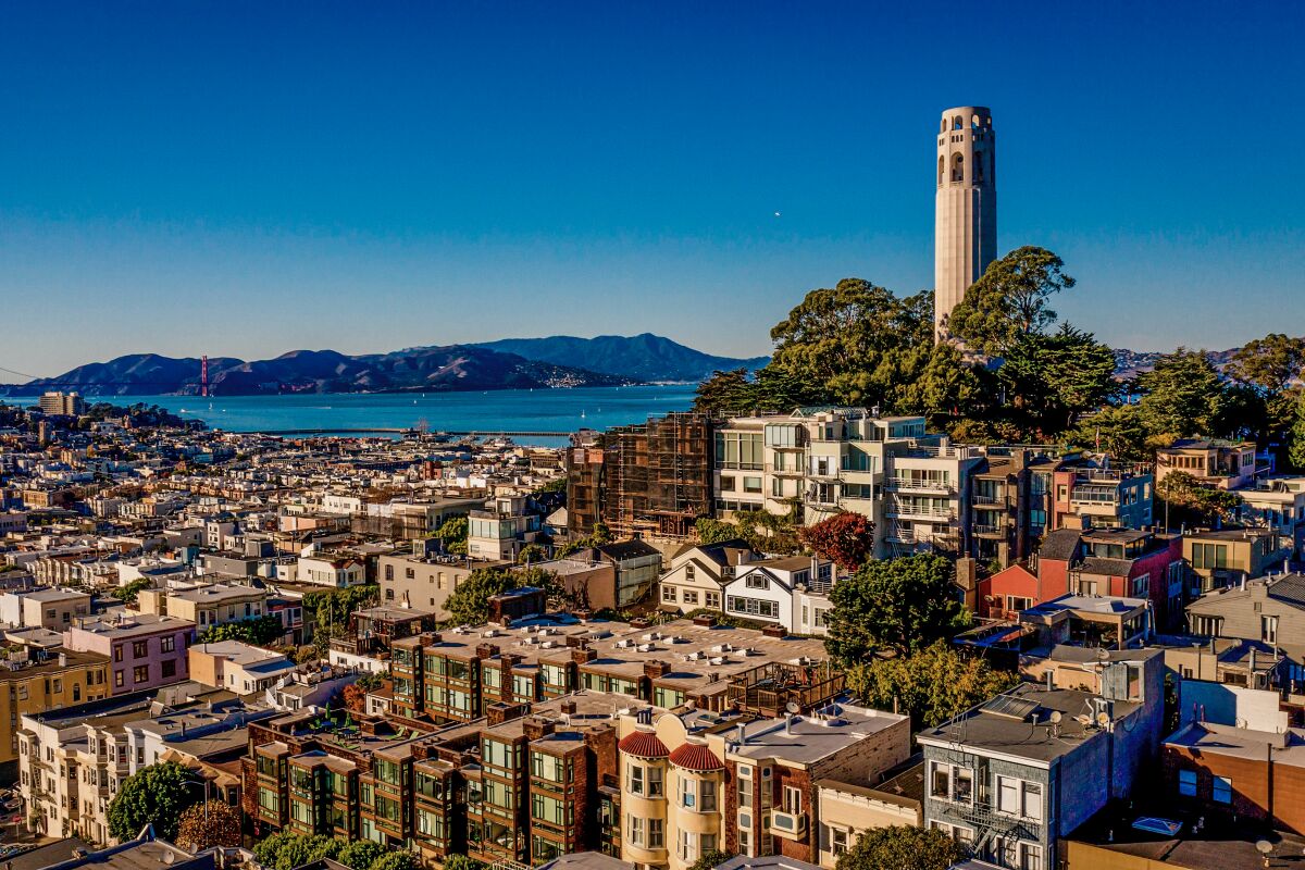 Coit Tower rises above the North Beach district of San Francisco and the surrounding neighborhood