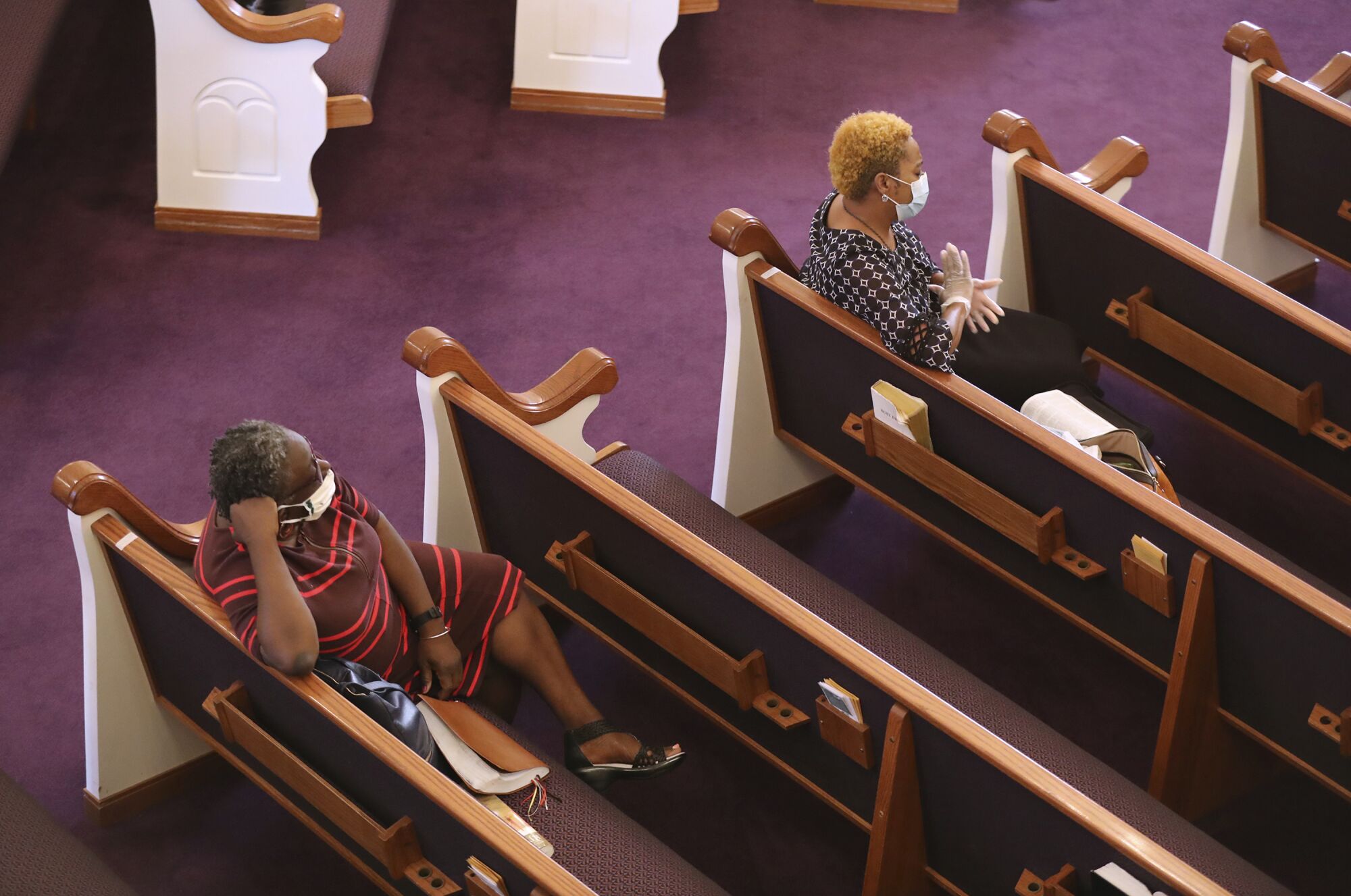 GEORGIA: Church members practice social distancing and wear masks while attending the Palm Sunday praise and worship service at Union Springs Baptist Church on Sunday in Rutledge, Ga.
