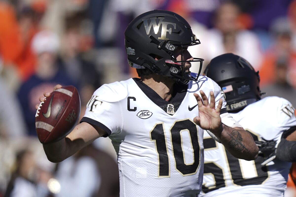 Wake Forest quarterback Sam Hartman sets to pass during the first half against Clemson.