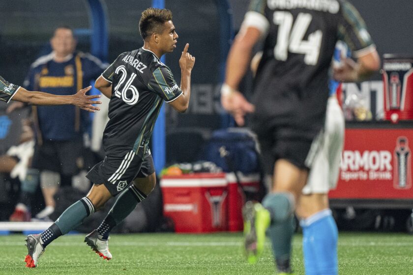 LA Galaxy midfielder Efrain Alvarez (26) celebrates after scoring goal during the second half.