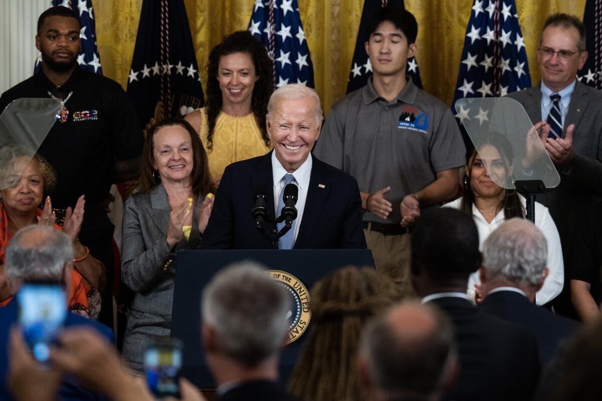 President Joe Biden on a stage.
