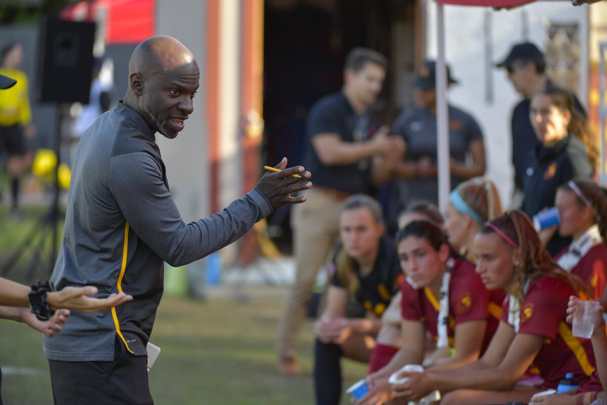 USC soccer coach Keidane McAlpine speaks to his players during an NCAA tournament match.