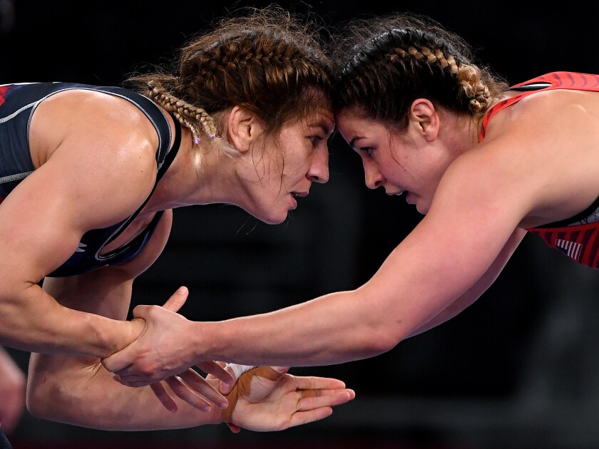 Adeline Gray and Yasemin Adar ares hown forehead to forehead.