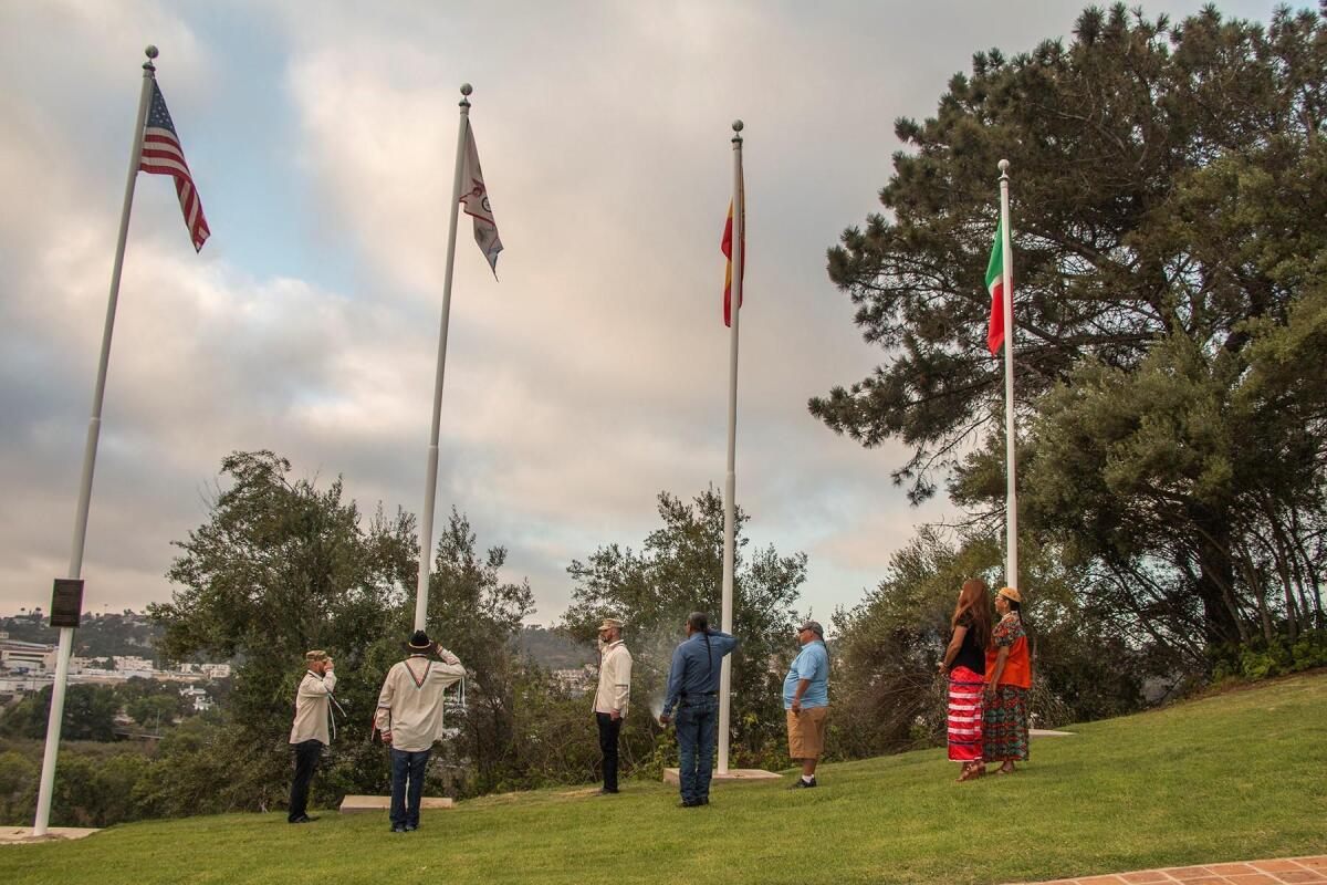 Four flags — American, Kumeyaay, Spanish and Mexican — now fly together at Presidio Park in San Diego. The July 16, 2019 event featured the dedication and addition of a Kumeyaay flag to the site.