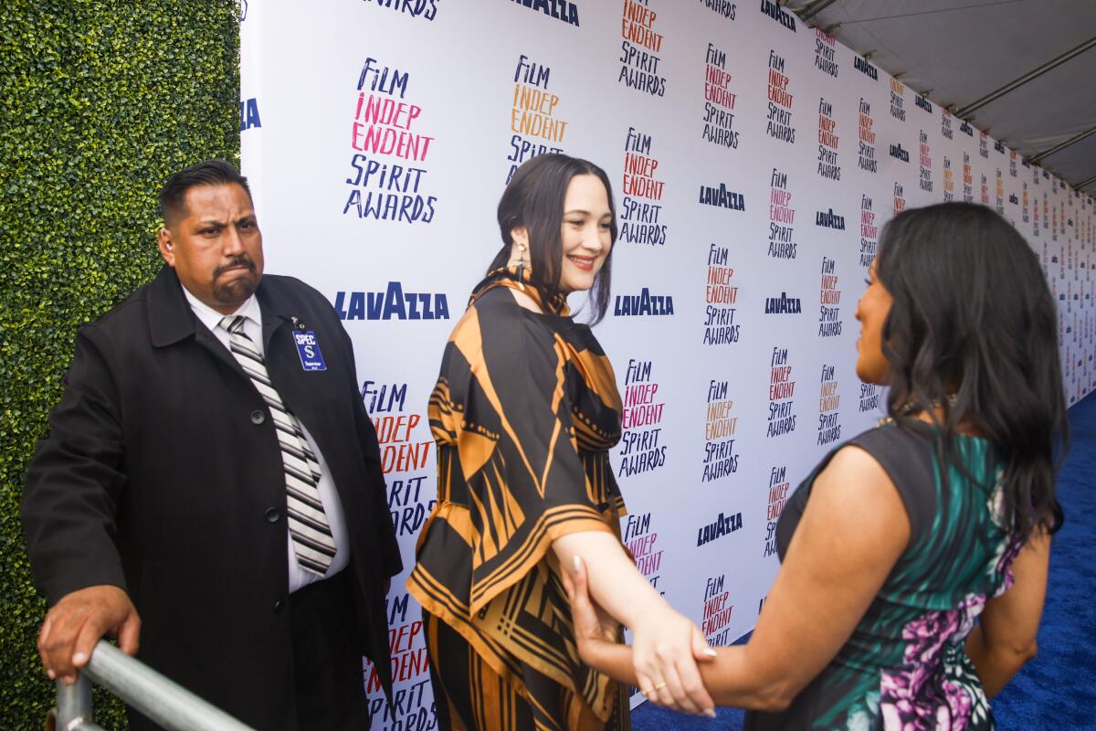 An actor greets a friend.