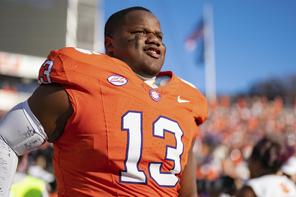 Clemson defensive tackle Tyler Davis (13) runs onto the field before agame against North Carolina.