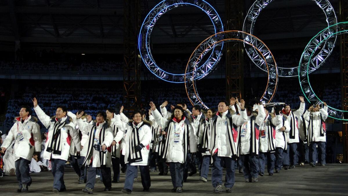 Athletes from North and South Korean march together during the opening ceremony of the 2006 Winter Olympics in Turin, Italy. The countries have discussed marching together in next month's opening ceremony of the Winter Games in Pyeongchang, South Korea.